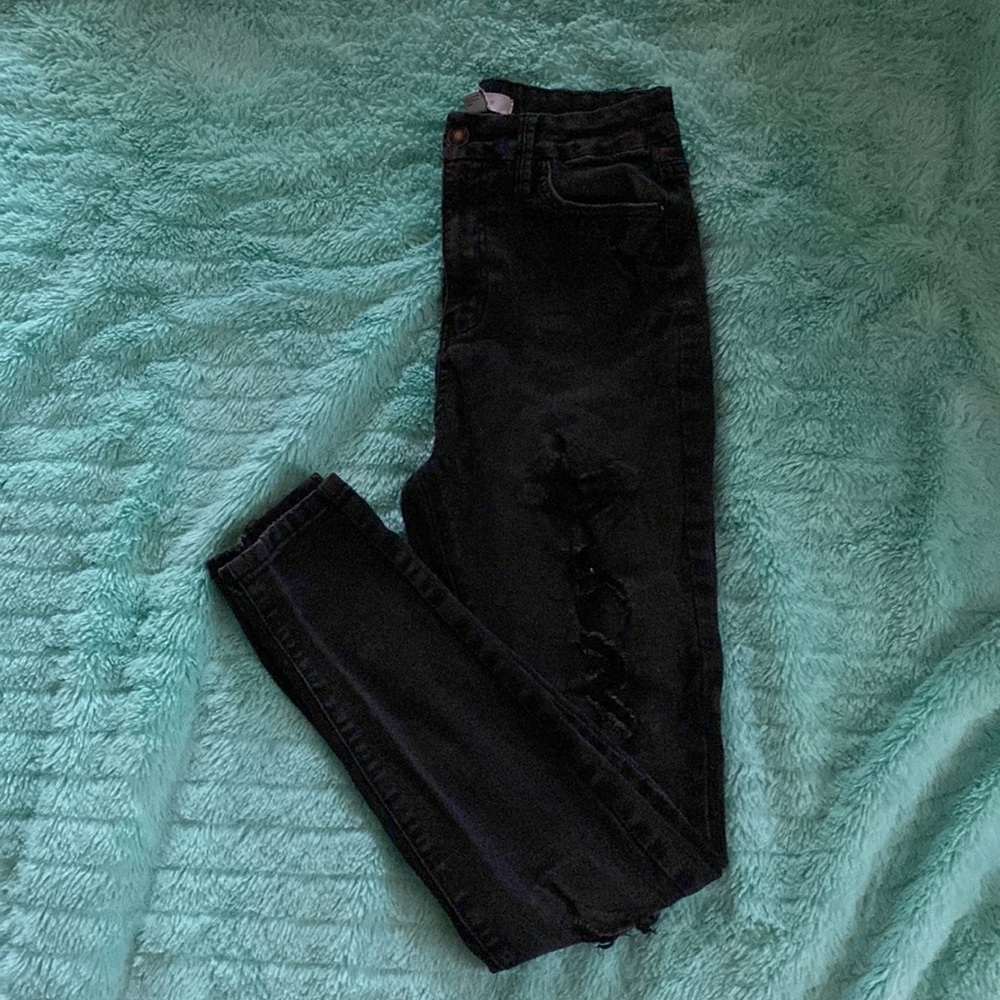 Forever 21 black jeans with holes and patches behind